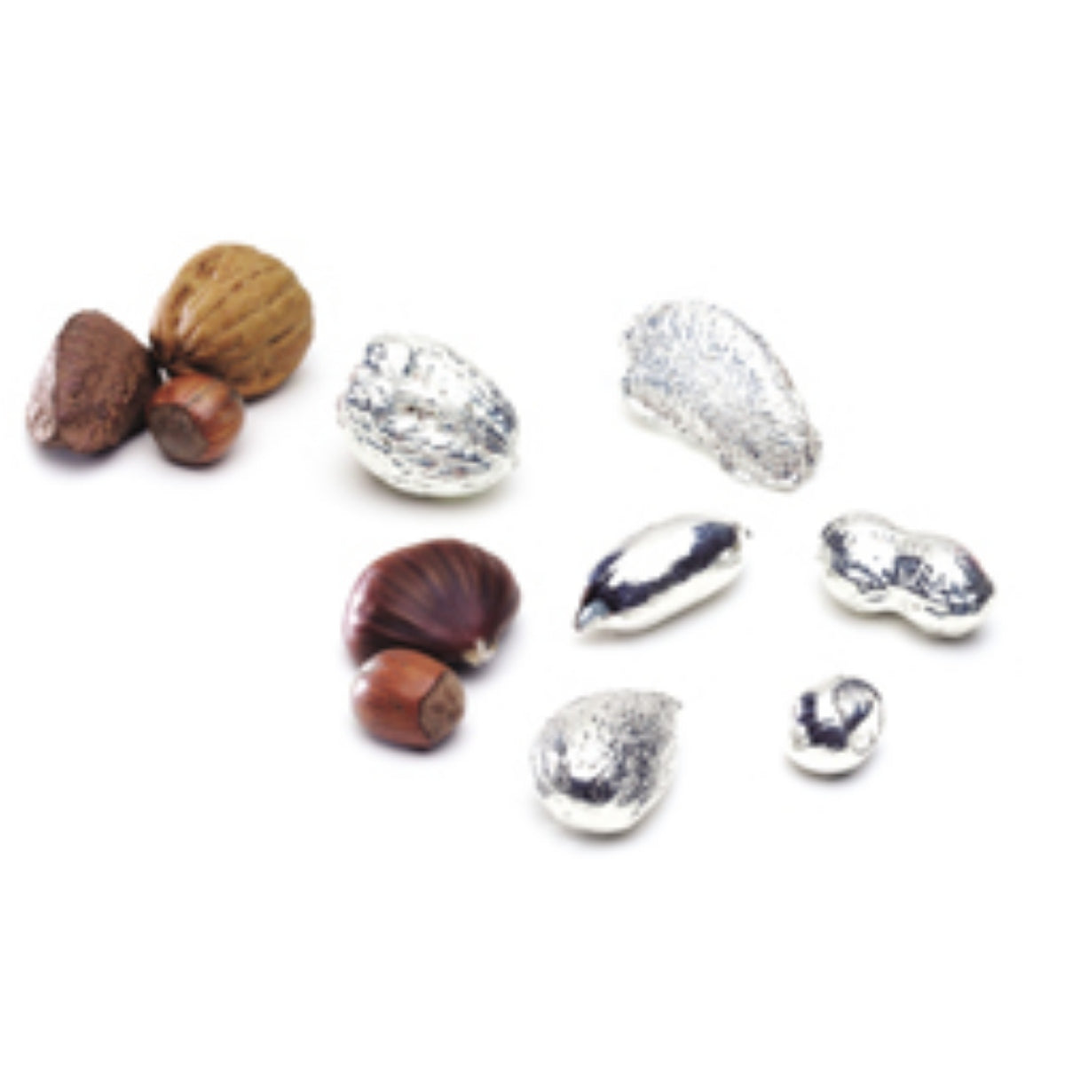 Set of Seven Sterling Silver Nuts